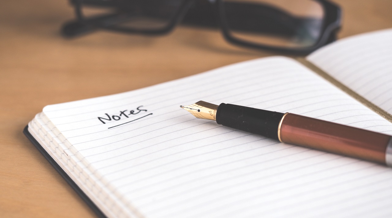 A pen on a notepad headed 'Notes'